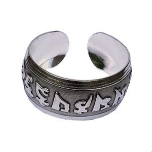 This is a pewter Tibetan "Om Mani Padme Hum" mantra cuff bracelet.